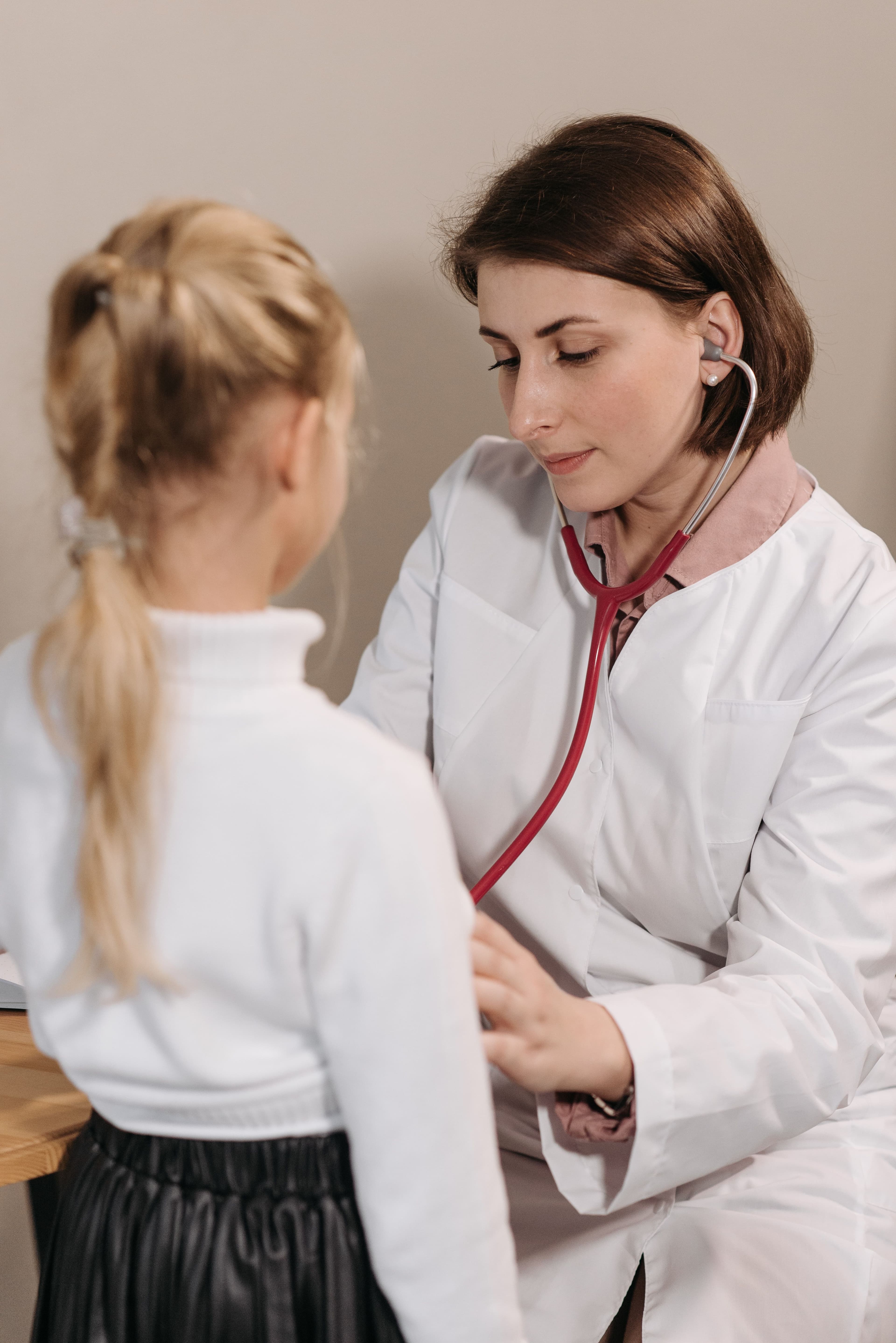 A doctor examining a child