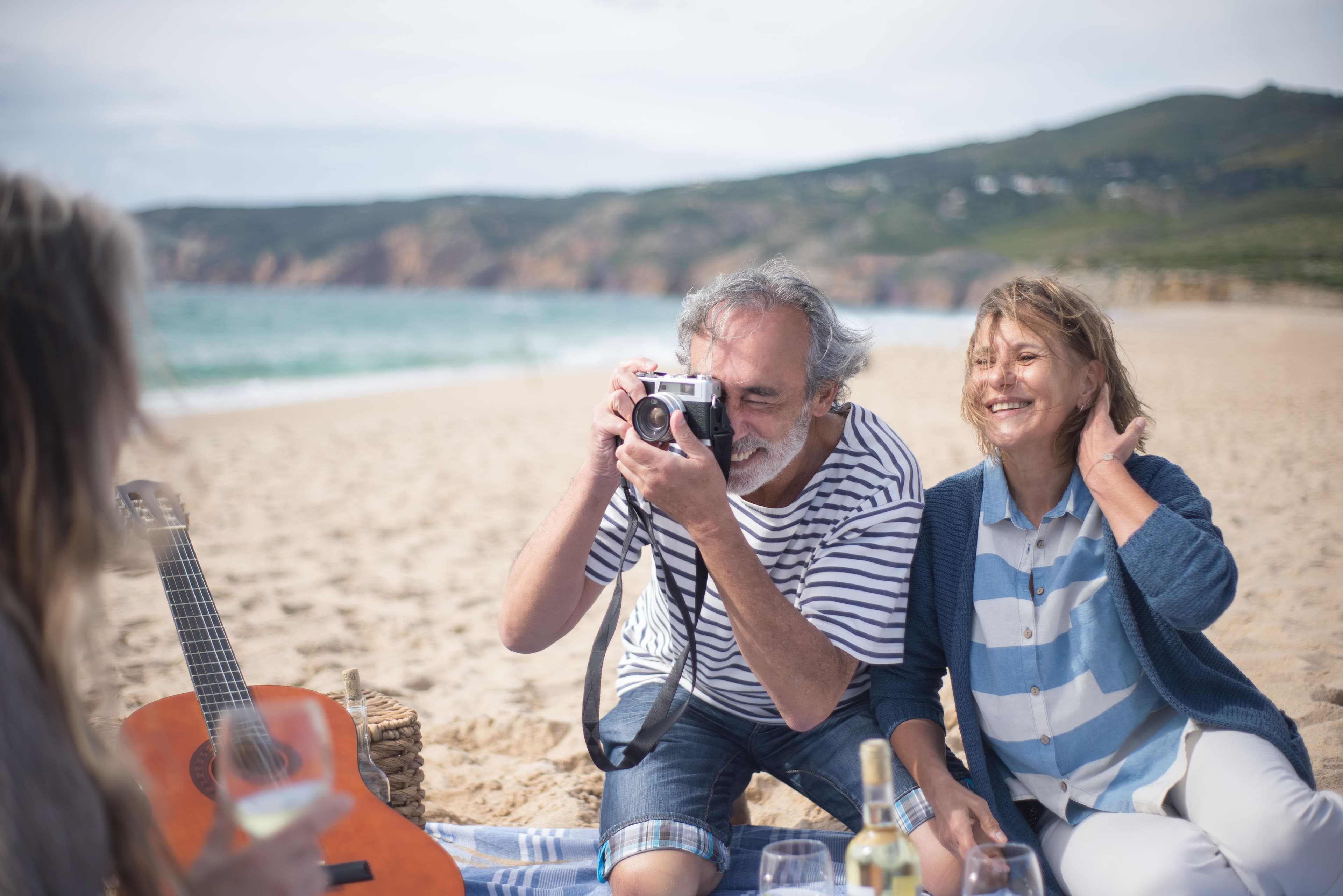 A retired couple enjoying time together on a beach