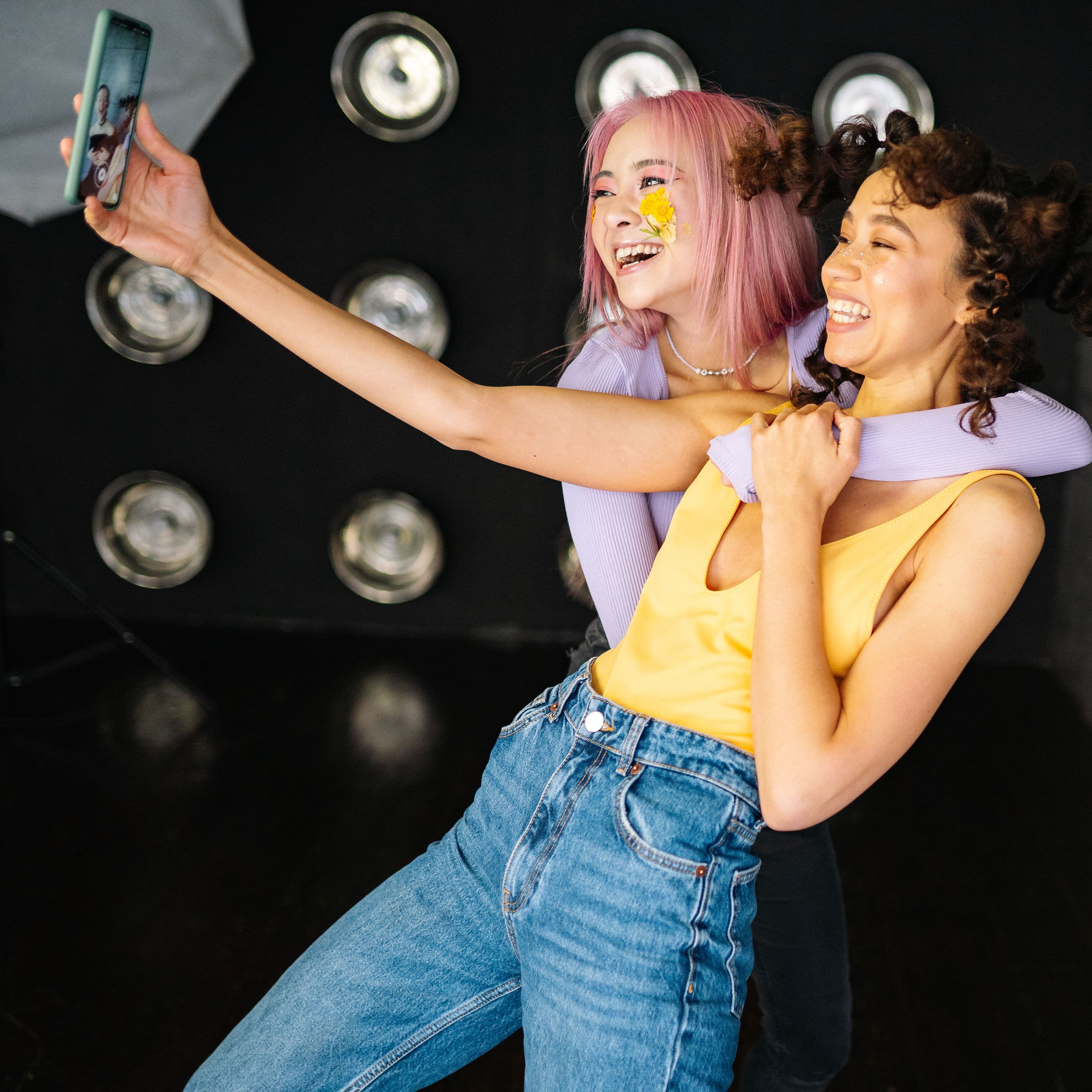 Two friends taking a selfie together and sharing an easy moment of connection